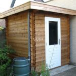 Small wooden garden shed with a flat roof