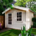 This log cabin has an apex roof and a single door